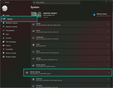 Windows 11 settings app showing how to access Nearby Sharing feature.