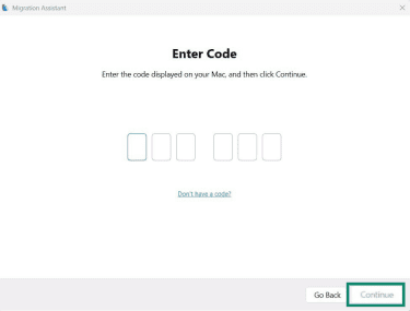 The Migration Assistant application on Windows, showing the option to enter a code to sync the Windows and macOS devices.